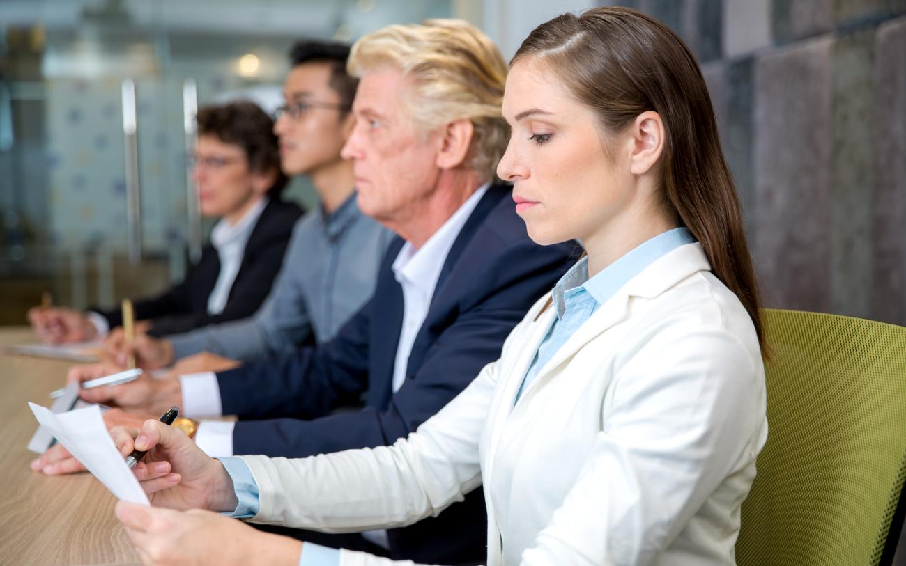 serious-young-businesswoman-sitting-conference.jpg