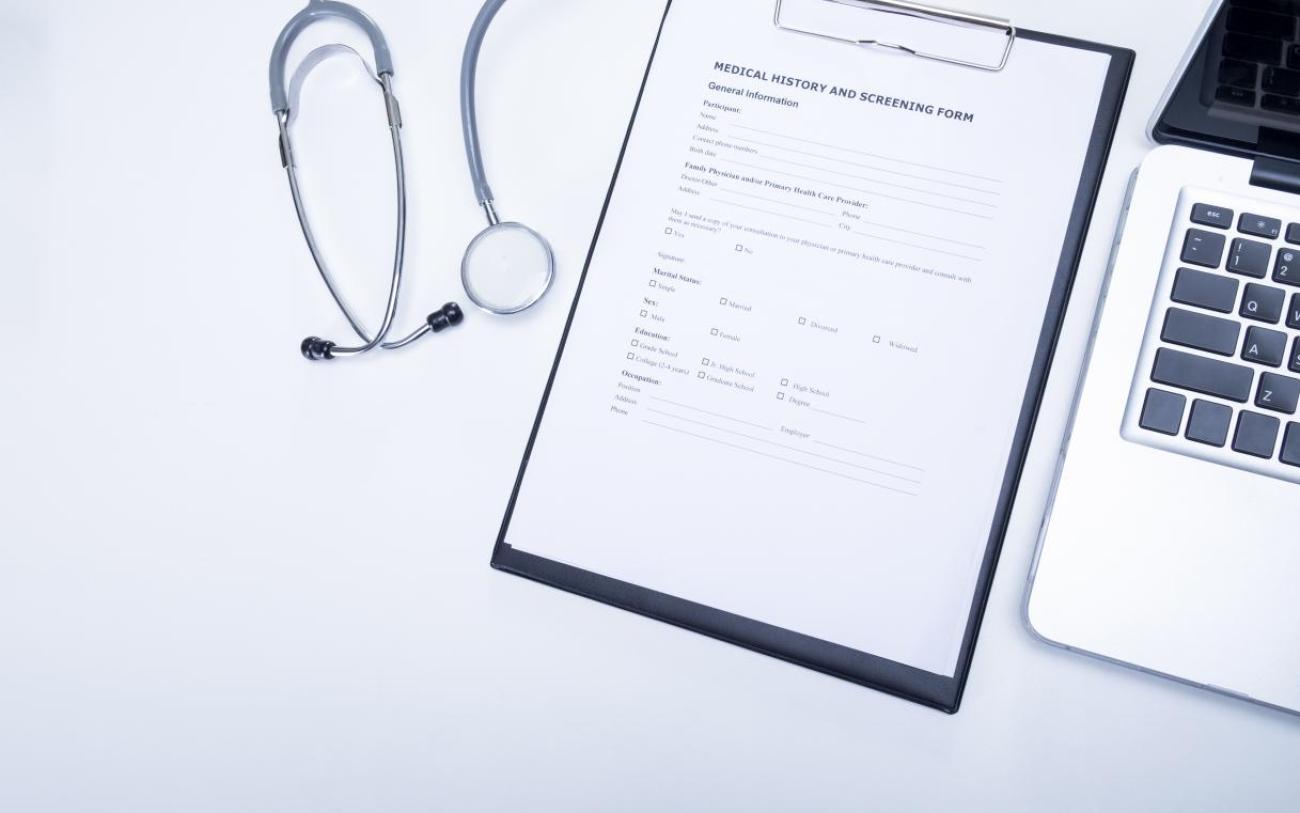 top-view-doctor-desktop-with-stethoscope-clipboard-with-medical-records-form-computer-laptop.jpg