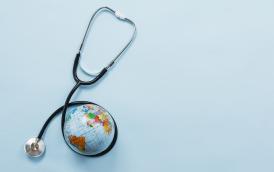 stethoscope-hugging-earth-blue-background